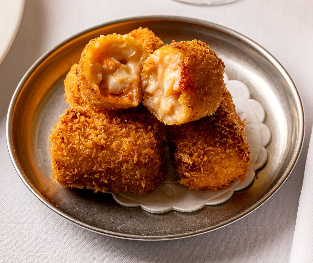 Lobster croquettes on a plate.