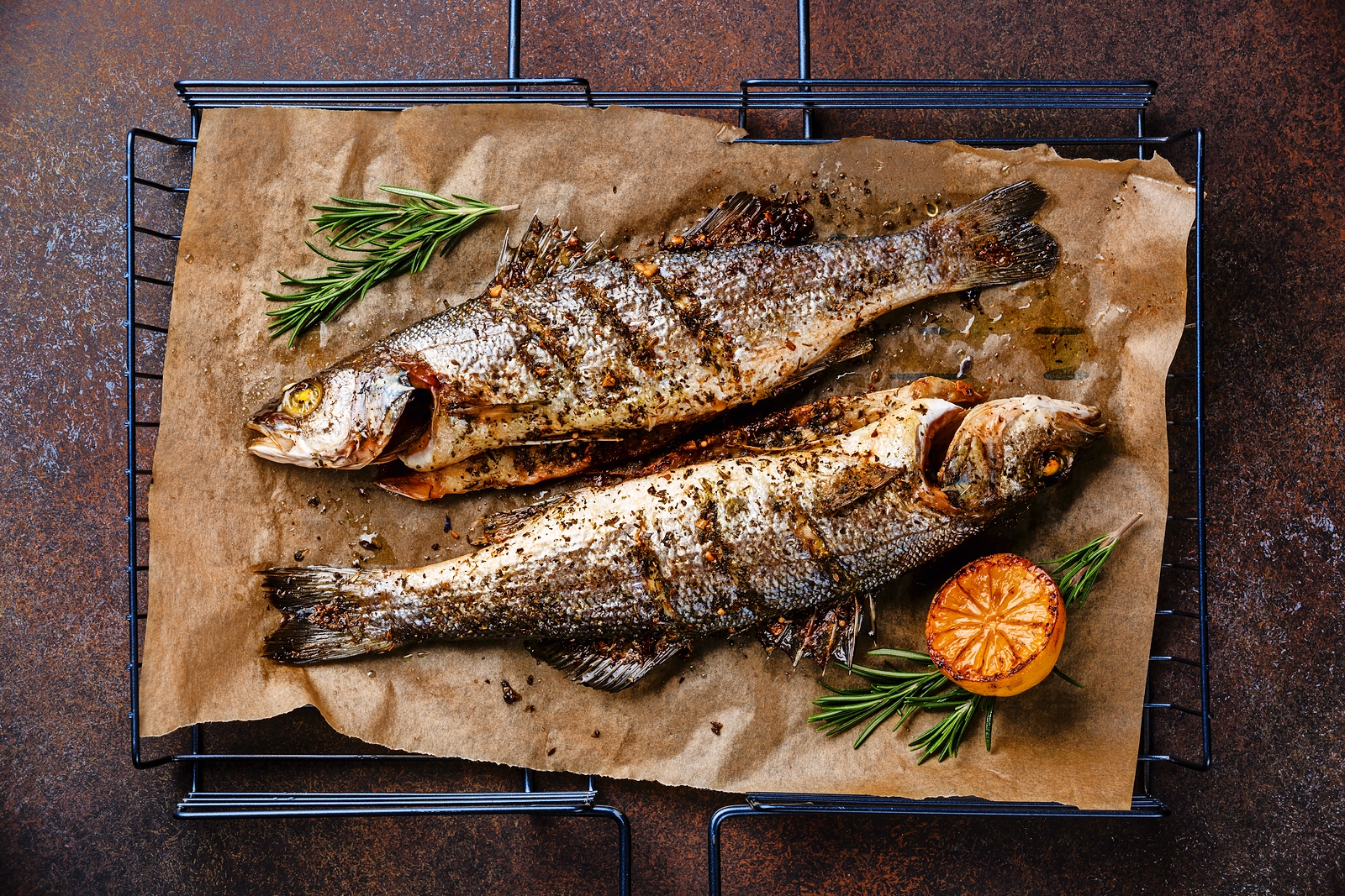 Grilled sea bass with lemon and rosemary.